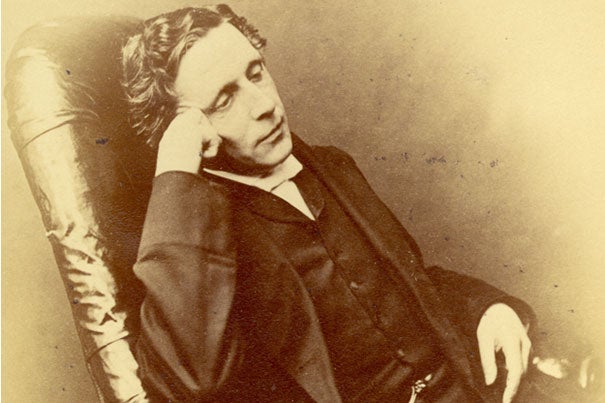 Lewis Carroll (photo 1), author of “Alice’s Adventures in Wonderland," used his own funds for the book's first printing but recalled the original copies due to their poor quality. One rare remaining original copy  was bound in white vellum (photo 2) and presented to Alice Liddell in 1865. Laura Larkin (left, photo 3) and Julia Featheringill prepare to photograph the materials, which will be on display at Houghton Library starting May 20.