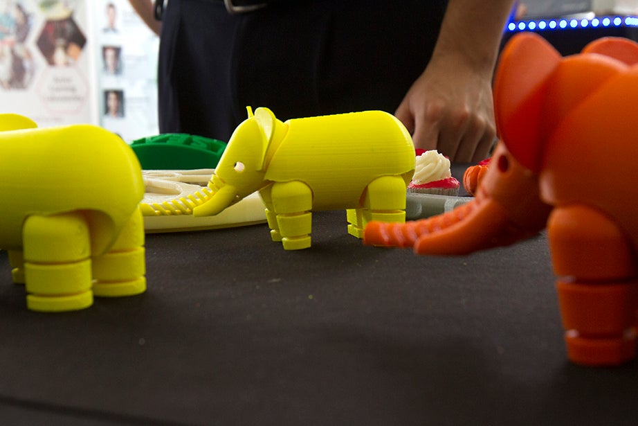 Neon elephants produced by a 3-D printer make a bright display. 
