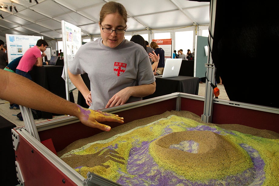 Elaine Kristant, senior mechanical and systems lab engineer, discusses contouring technology in a sandbox. 
