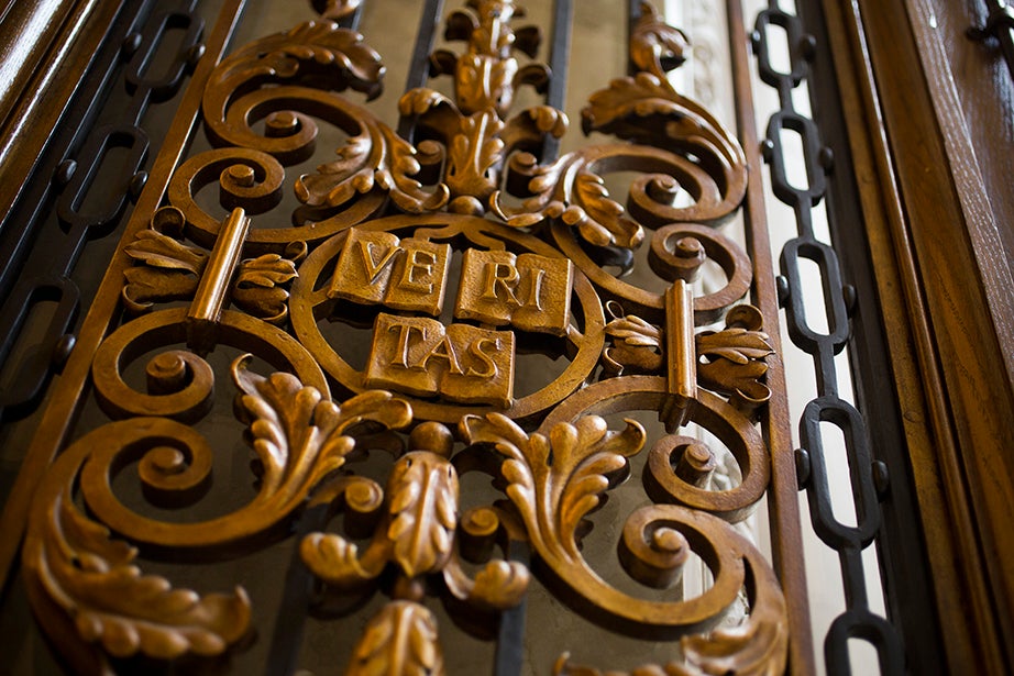 A Veritas shield in wrought iron at the entrance to the Harry Elkins Widener Memorial Library.