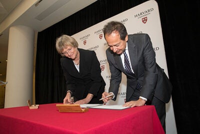 A signing ceremony with  John A. Paulson, M.B.A. '80, and President Drew Faust marked the celebration of Harvard's largest gift. The $400 million will  support research, teaching, financial aid, and faculty development for Harvard’s School of Engineering and Applied Sciences, which has been renamed in honor of Paulson.