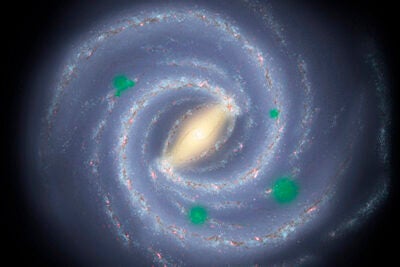 In this artist’s theoretical conception of the Milky Way galaxy, translucent green “bubbles” mark areas where life has spread beyond its home system to create cosmic oases, a process called panspermia. New research suggests that if it occurs, we could detect possible signs of life on planets orbiting distant stars.