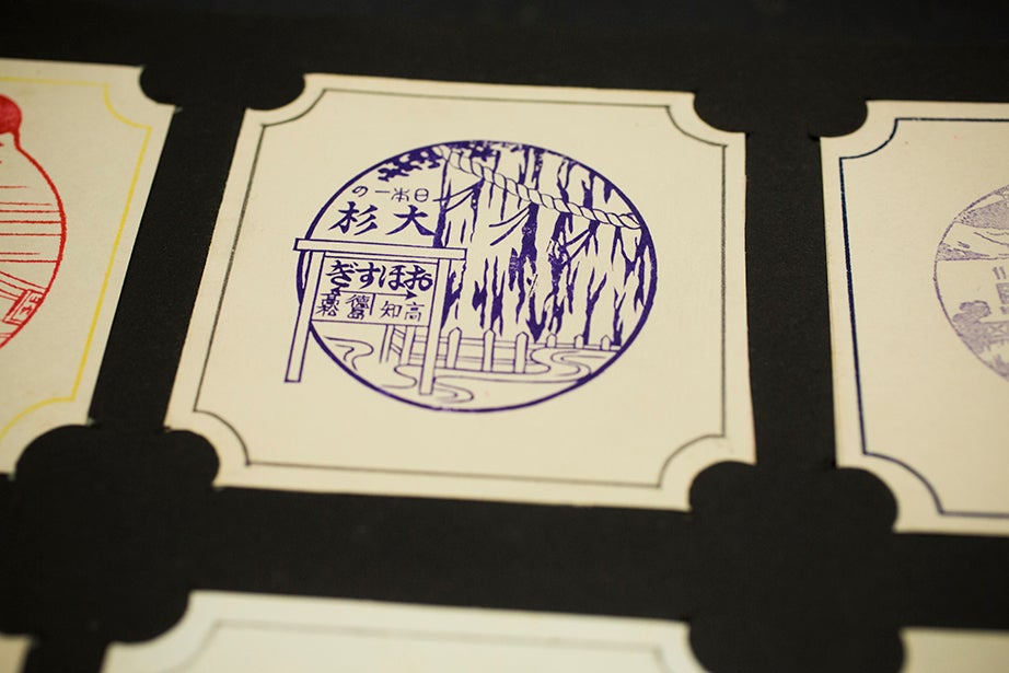 Multihued inked stamp prints show travel, landscapes, and activities.