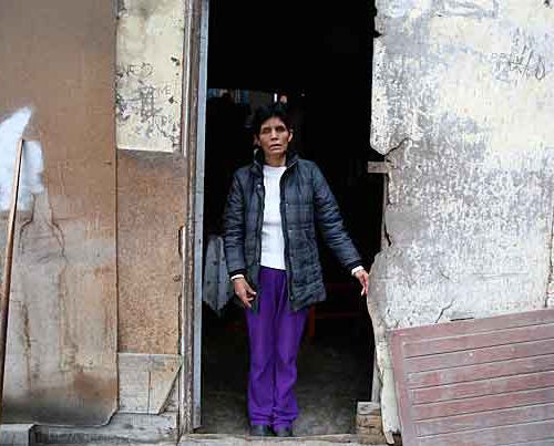 Hilda Matos at her home in Palao, a shantytown on the outskirts of Lima, where she awaits the visit of a community health worker from Socios En Salud, Partners In Health’s sister organization in Peru. The worker makes sure Matos follows her treatment for XDR-TB, a type of tuberculosis extremely resistant to medication.