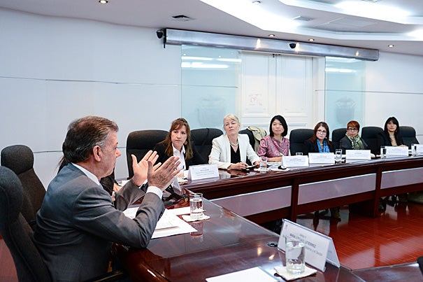 A Harvard report on Colombia's reparations program caught the eye of President Juan Manuel Santos, who asked Kathryn Sikkink and Phuong Pham (second and third from left) to present their findings. Douglas Johnson, director of the Carr Center for Human Rights Policy, was the third member of the fact-finding team.