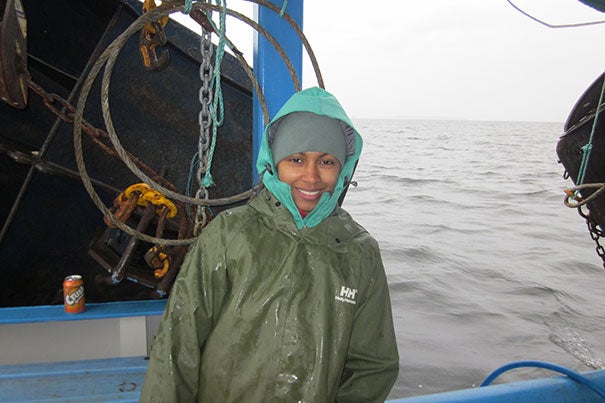 Postdoctoral fellow Amina Schartup, the paper’s first author, aboard the “What’s Happening” on Lake Melville. In 2017, a dam will flood a large region upstream from an estuarine fjord called Lake Melville. 