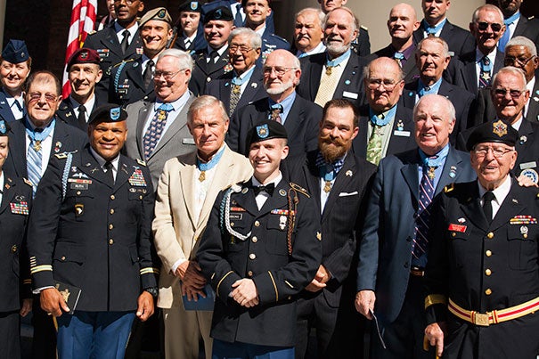 More than 40 of the 78 living recipients of the Congressional Medal of Honor gathered at the Memorial Church Friday for a private memorial service (photo 1). They were welcomed by Harvard veterans and ROTC members (photo 2). Thomas Reardon '68 (from left, photo 3), director of the Harvard Veterans Alumni Organization, stood as Harvard Kennedy School student Lt. Reuden Luoma-Overstreet greeted a veteran.