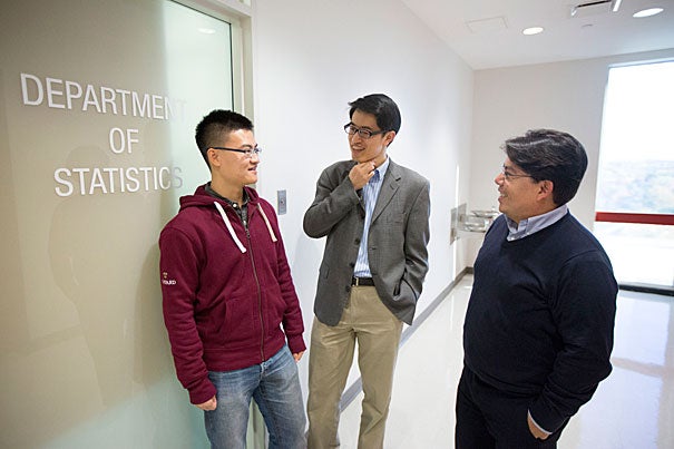 CDC data are considered something of a gold standard in disease surveillance, but it takes one to three weeks for reports to be compiled, making it hard for public health officials to stay ahead of the flu, said Samuel Kou (center), a professor of statistics. Kou worked with Shihao Yang (left) and Mauricio Santillana to deliver results in real time.