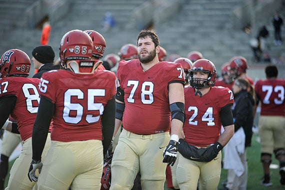 Harvard football v. Penn. Outside linebacker Cole Toner '16 looks at the clock as time winds down with the Crimson losing to Penn. Jon Chase/Harvard Staff Photographer