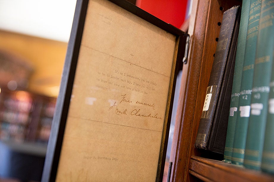 A letter signed by Neville Chamberlain is on display in the Eliot House library.