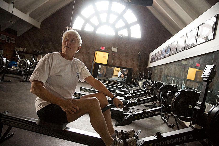 Kathy Keeler, an Olympic gold medalist, volunteer coach with the Radcliffe crew team, and widow of the late Harry Parker (the Thomas Bolles Head Coach for Harvard men’s heavyweight crew for 51 seasons), works out on a rowing machine inside Weld Boathouse.