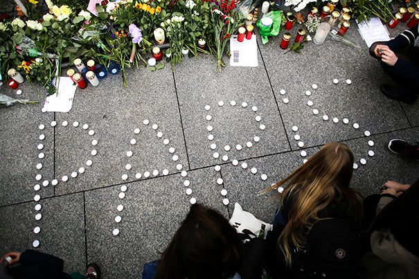 During a pair of interviews, Harvard Kennedy School analysts weighed in on the deadly and shocking terrorist attacks believed orchestrated by the Islamic State in Paris and Beirut. With the world still shocked by the violent attacks, young women formed  the word Paris with candles to mourn for the victims killed in  Friday's attacks in Paris.