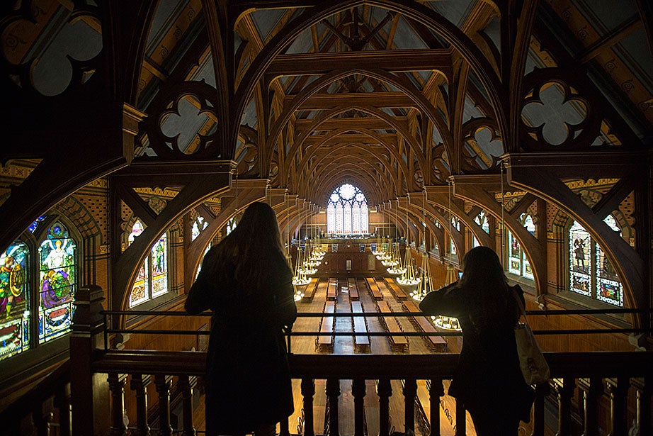 This overview shows people admiring the architectural details of Annenberg Hall, which are said to have inspired the décor for the great hall in the Harry Potter movies.