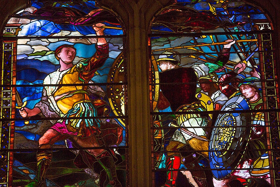 Artist John La Farge created this window of a classical warrior clad in a light-colored cuirass, striding toward the viewer’s left with his body and head turned back to encourage his followers in 1881.