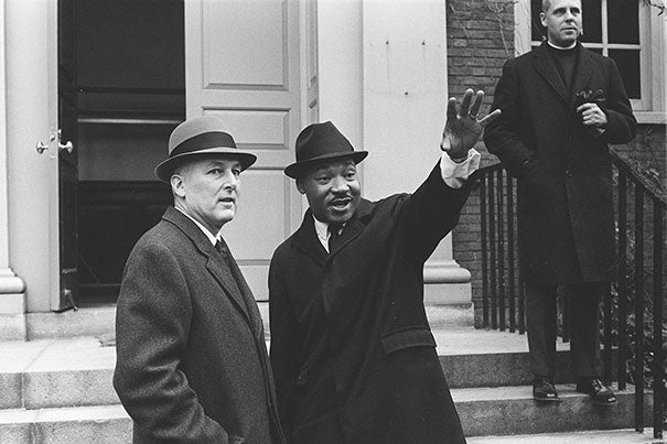 A January visit in 1965 shows Martin Luther King Jr. with Nathan M. Pusey (left), Harvard’s 24th president, and the Rev. Charles P. Price on the steps of Appleton Chapel. The visit came just two months before the televised violence of the protest march in Selma, Ala.