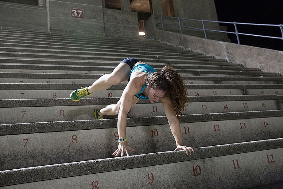 Not to be outdone by Steve Zolud’s downward bear crawl, Emily Saul, a trainer with the November Project, demonstrates a bear crawl up the steps, and backwards. Very few step climbers perform this routine, with good reason: It is extremely difficult and exhausting.