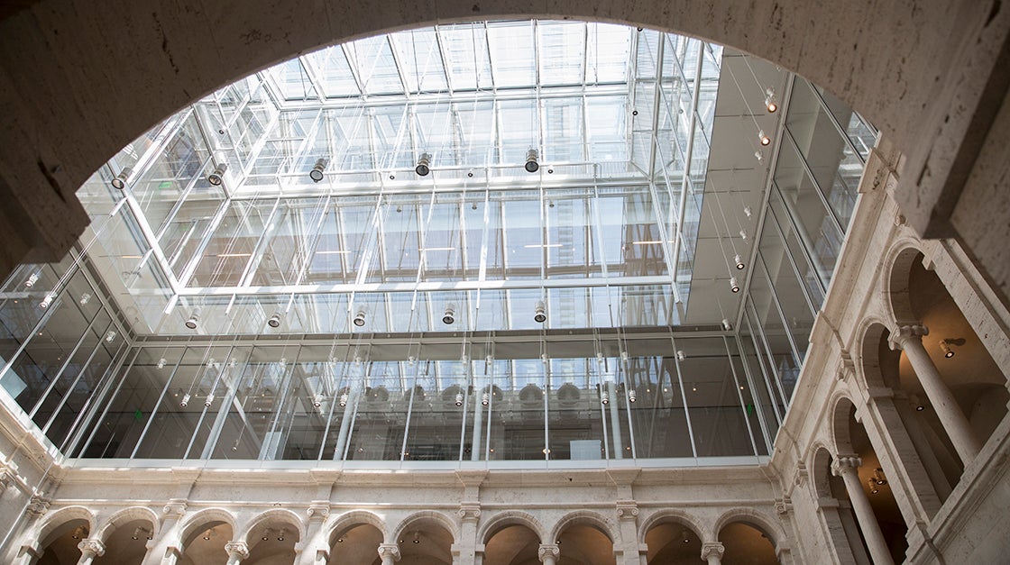 The new glass rooftop that now tops Harvard Art Museums allows natural light to filter down into the courtyard. 