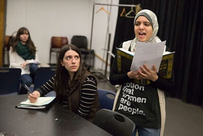 Sammi Cannold (center), an artistic fellow at the American Repertory Theater, oversees a rehearsal of "A Language to Hear Myself" with Anwar Omeish '19 (right) and Caro Ribeiro '18 (left). 