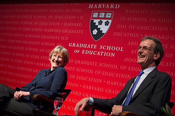 Harvard President Drew Faust and her brother, retired English and drama teacher Donald Gilpin, shared their thoughts on education at an Askwith Forum at the Harvard Graduate School of Education. Faust emphasized that education is about civic engagement, human engagement, and meaningful lives.