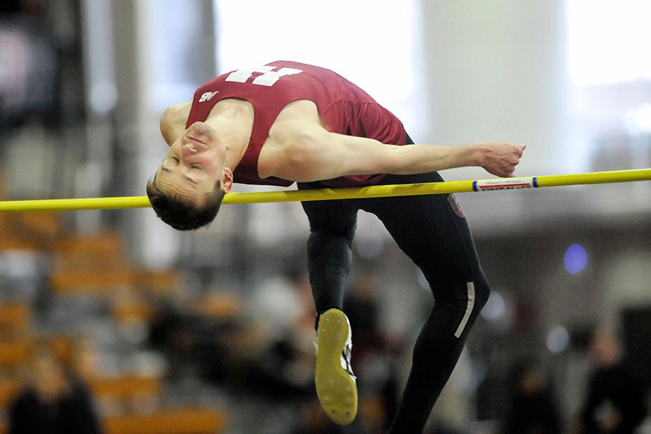 Spencer Lemons ’16 clears the high jump bar. Lemons won the event with a leap of 6 feet 6.25 inches (1.99 meters), tying a season high.