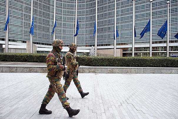 Following Tuesday's bombings, security forces patrol the area in front of the European Commission building in Brussels. Analysts said the attacks expose serious flaws in the effectiveness of the European Union’s security and intelligence agencies. 