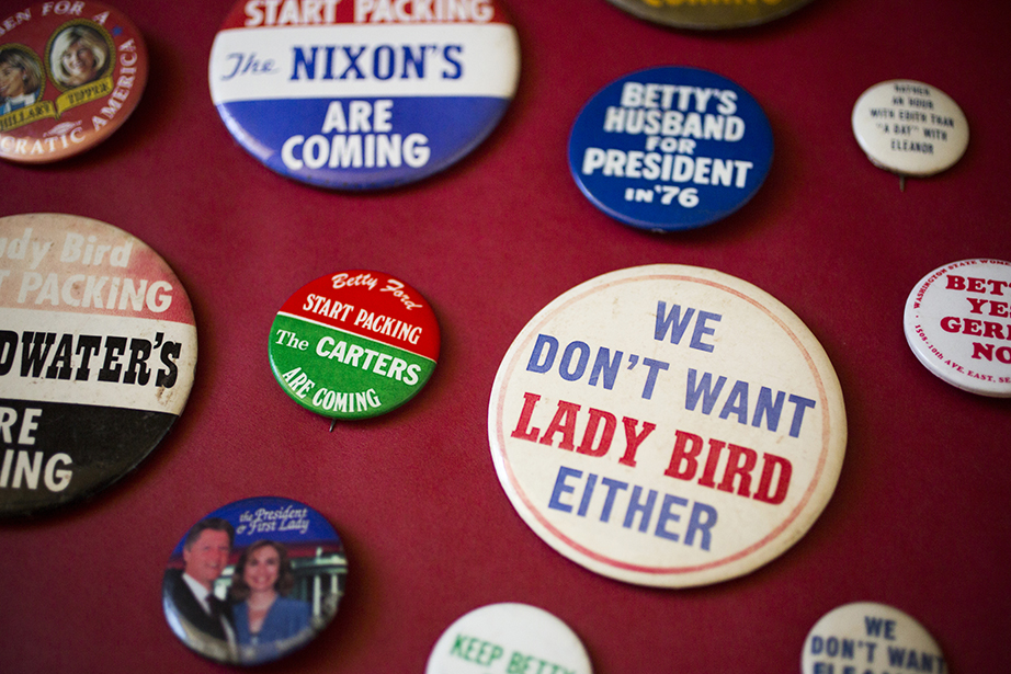 Campaign buttons are not just for the candidates but also for their spouses.