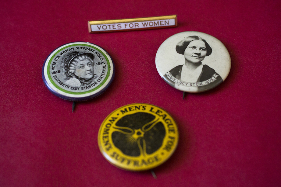Women’s suffrage buttons show the likenesses of early suffragists Elizabeth Cady Stanton and Lucy Stone.