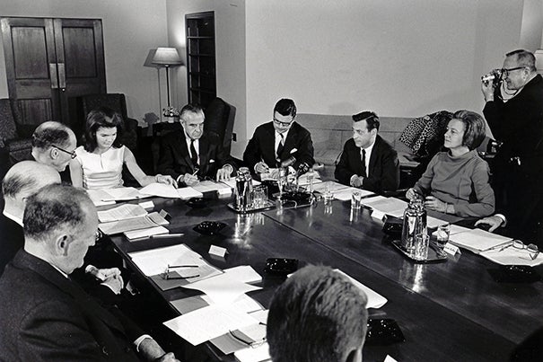First lady Jacqueline Kennedy presides over the first-ever IOP Senior Advisory Committee meeting.
Starting just to Kennedy's right, going clockwise:
Nathan Pusey, president of Harvard University,  Kennedy, W. Averell Harriman, chairman, IOP Senior Advisory Committee, Michael Forrestal,executive secretary, IOP Senior Advisory Committee, Richard Neustadt, director, Institute of Politics, Katharine Graham, member, IOP Senior Advisory Committee.