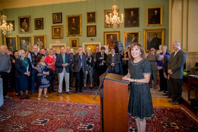 Accolades were bestowed upon Diana Sorensen (at podium), who is stepping down as Harvard's dean of arts and humanities. In the 10 years since being appointed, Sorensen has supported nearly a dozen new and enhanced curricular and outreach efforts.