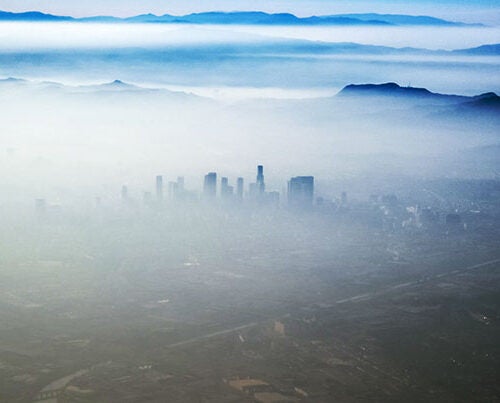 "High temperatures are also accompanied by weak winds, causing the atmosphere to stagnate. So the air just cooks and ozone levels can build up,” said Loretta J. Mickley, a co-author of the study. Pictured is the smog that sometimes blankets Los Angeles.

