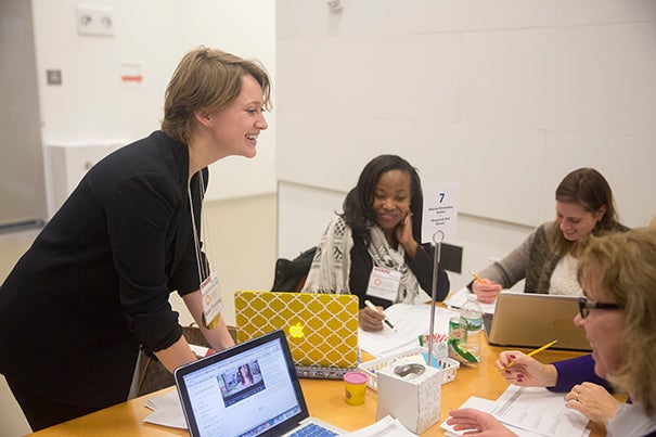 Kate Fleming (from left) of Boston Public Schools talks with Yeshi Lamour and Erin Vanderveer from Holmes Elementary School. HarvardX's Data Wise course is facilitating conversation among educators across the city. 