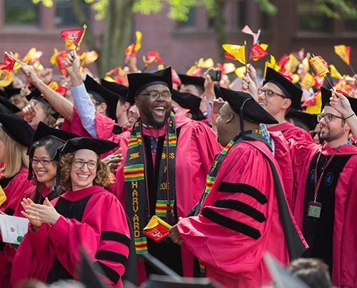 Mather House resident tutor Tony Jack, (center) celebrates with Ph.D. recipients celebrate during the 365th Commencement Exercises in the Tercentenary Theatre Kris Snibbe/Harvard Staff Photographer