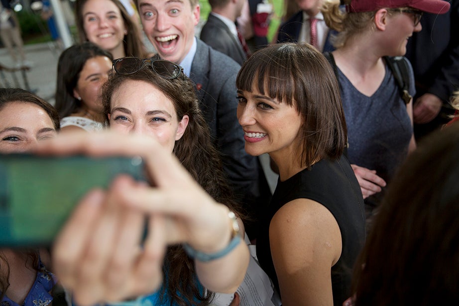 Class Day Exercises featured speaker Rashida Jones ’97 (right), who posed for a selfie with students on the stage. Rose Lincoln/Harvard Staff Photographer