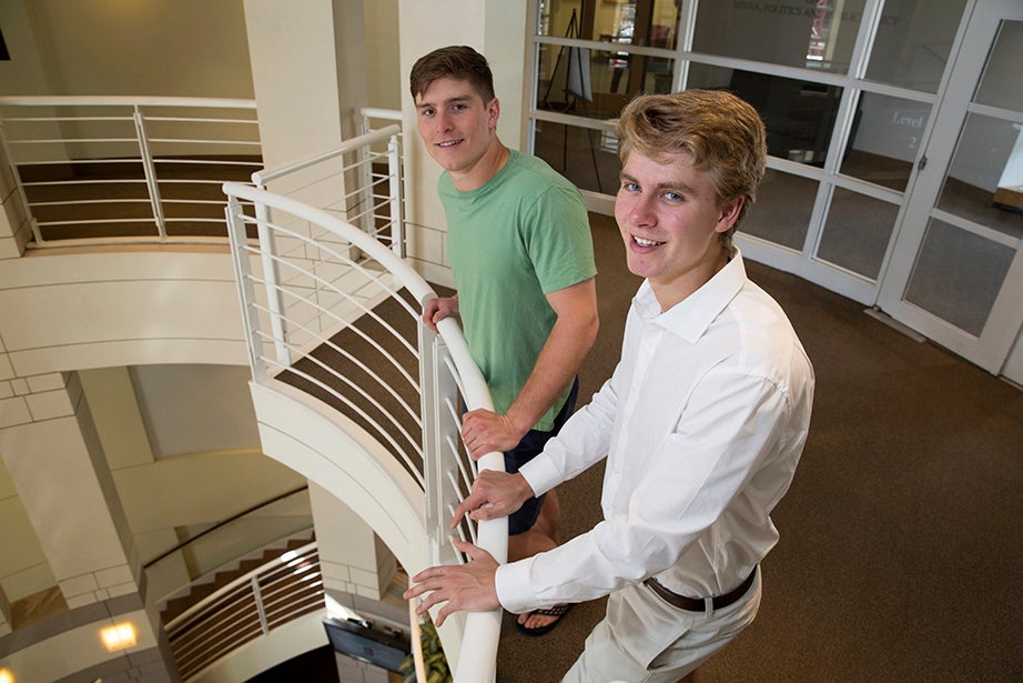 Beau (left) and Nicholas Bayh '18 stand in the Taubman Center at Harvard Kennedy School. Their interest in public service stems from a family legacy: Their grandfather Birch Bayh and father, Evan Bayh, have both served as their state’s governor and U.S. senator. Jon Chase/Harvard Staff Photographer