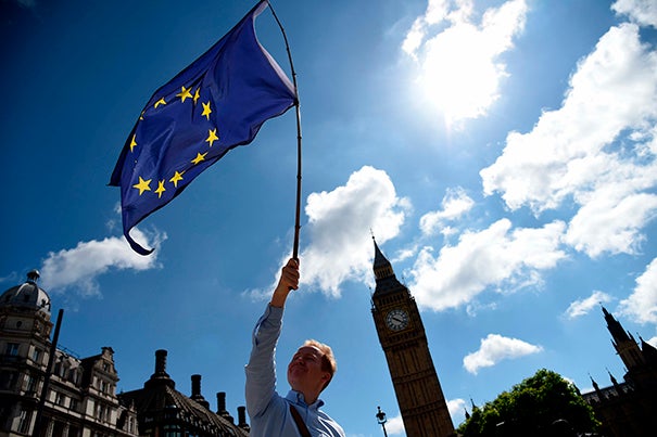 James Laurent waved a European Union flag outside the houses of Parliament in London on Friday.