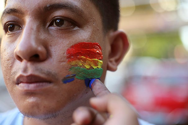 The shooting was mourned around the world, including in the Philippines, where a youth activist had his face painted to honor the victims. 
