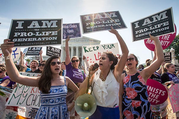 Anti-abortion activists demonstrated in front of the Supreme Court on Monday.