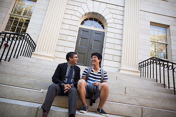 Dean of Harvard College Rakesh Khurana (left) speaks with Melvin Woo '19 on the University Hall steps. Stephanie Mitchell/Harvard Staff Photographer