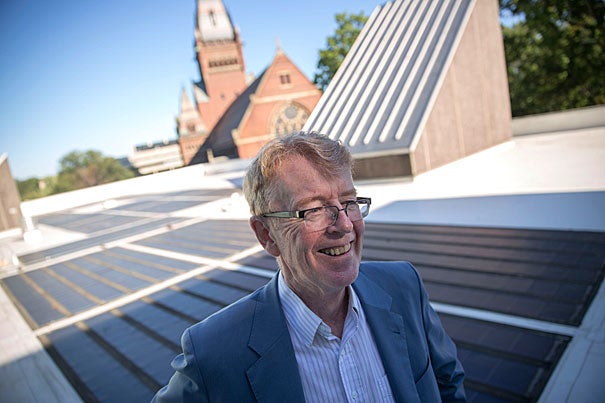 Atop the roof of the Science Center with solar panels in the background, SEAS/EPS Professor Michael McElroy talks about his new book, “Energy and Climate: Vision for the Future,” on the global energy challenge with climate change.