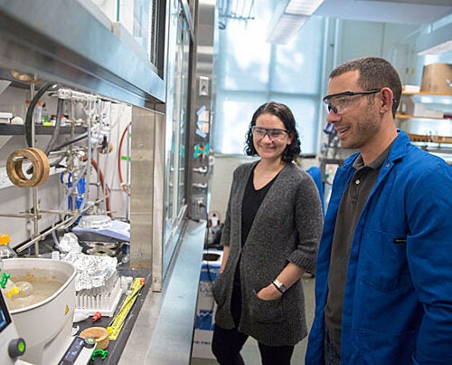 Emily Balskus (left), Morris Kahn Associate Professor of Chemistry and Chemical Biology, and Postdoctoral Fellow Matthew Wilson are co-authors of a study that details the development of a tool that may help researchers better identify enzymes present in microbiomes.
