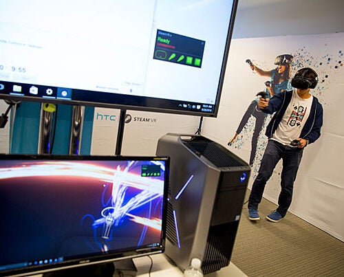 Harvard Business School student Brandon Tseng, M.B.A. '17, tries out virtual reality in the i-lab as part of HUBweek's augmented and virtual reality segment.