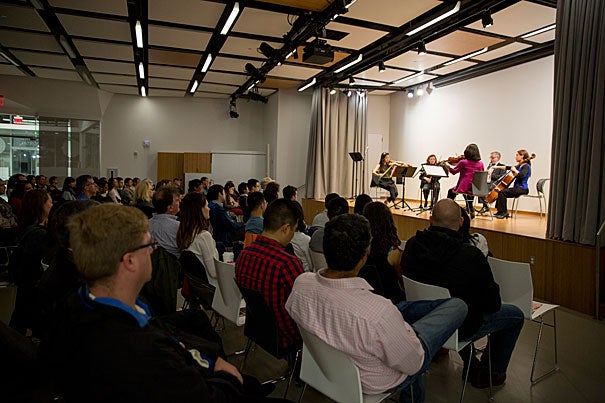 Physician and violinist Lisa Wong (in pink) was among the members of the Longwood Symphony Orchestra who described the connection between music and medicine  during a panel discussion at the Ed Portal. 
