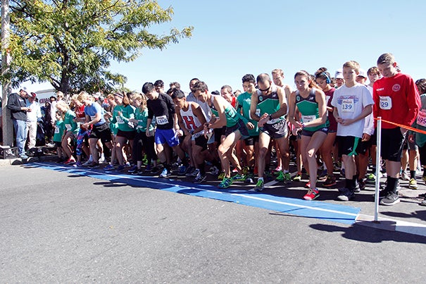 Runners set their feet and watches as they wait for the starting pistol at the 13th annual Brian J. Honan 5K Run. Photo by Stew Milne