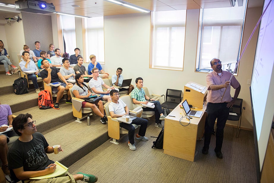 L. Mahadevan teaches “Fluid Dynamics” in the Cruft Building. The course explores continuum mechanics; conservation of mass and momentum; energy, stress, kinematics, and constitutive equations; vector and tensor calculus; and dimensional analysis and scaling. Kris Snibbe/Harvard Staff Photographer