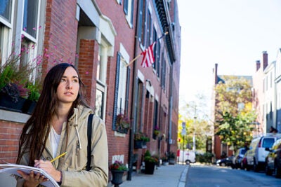 Avila Reynolds '20 tours Charlestown to research income inequality in the neighborhood. “The neighborhoods are so different and they’re so close to each other,” she said. “They’re reflective of the income differences.”