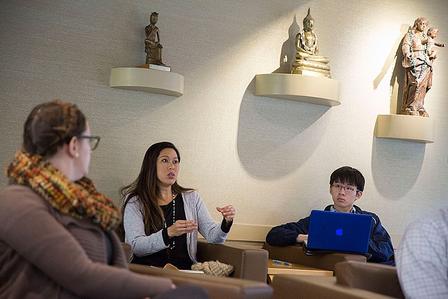 Vicky Lee (left) and William Wang ’20 discuss ballot questions during “Religion in the News: How Shall We Vote?,” a lunchtime event in the CSWR common room. 