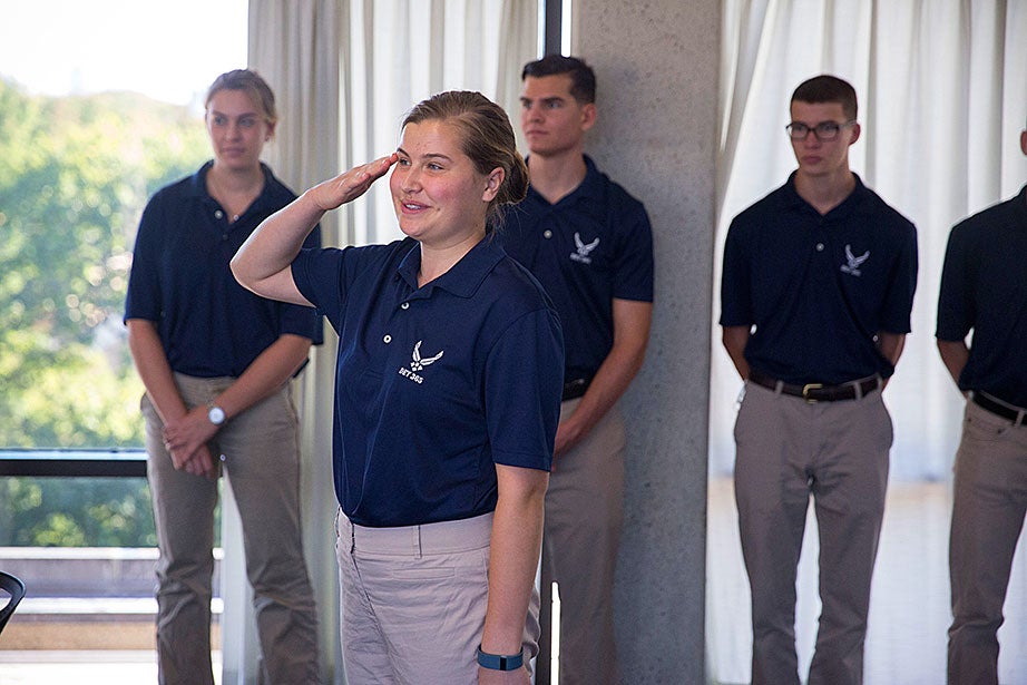 Katherine Krolicki ’20, salutes while standing at attention, while Rachel Collins ’20 (left) looks on. “My goal is to become an intelligence officer because I have a desire to serve my country,” said Krolicki, “Air Force ROTC has provided me with an amazing community and team. All of the cadets give me so much support in and outside of the program.” 