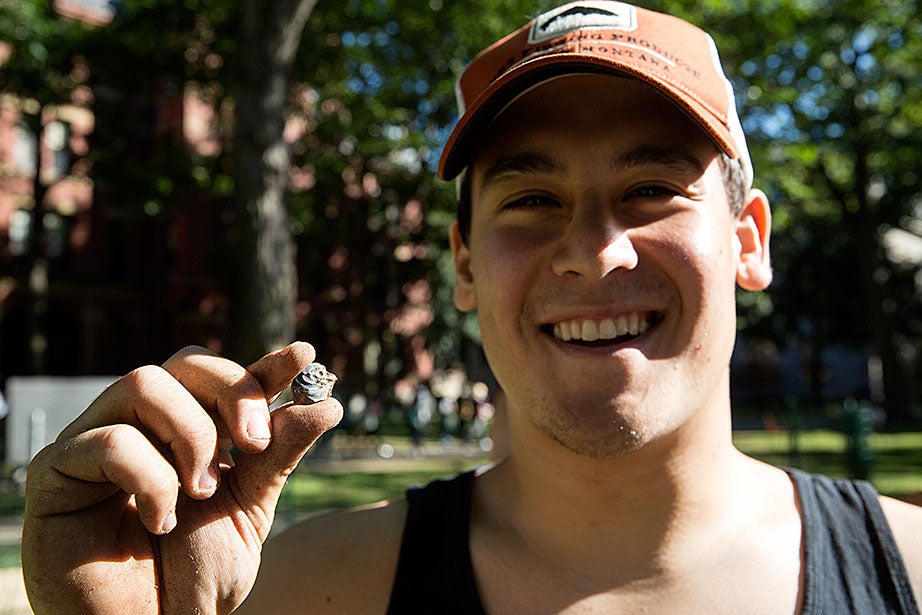 William Mendez ’17 displays a ceramic shard unearthed that day. Ceramics were used in dining, food storage, and food preparation.