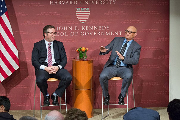 Director of the Shorenstein Center Nicco Mele (left) laughs at a retort by comedian Larry Wilmore during their talk at the Harvard Kennedy School. “I do find it ironic that we elect a reality show star as president, and you invite a fake journalist to give the Theodore H. White lecture on it,” said Wilmore.