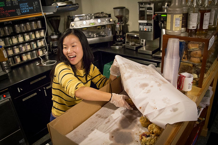 7:51 a.m. — Harvard University junior and Café Gato Rojo employee Blessing Jee jokes with her manager, grad student Peter Kim, as she unloads fresh pastries delivered daily from the Danish Pastry House, a local bakery. The coffee house in the basement of Dudley House is student-run, and accessible only to members of the University.